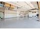 Spacious garage with epoxy flooring, ample storage cabinets, and a clean, well-organized layout at 8300 E Lone Mountain Rd, Scottsdale, AZ 85266