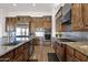 Large open kitchen with stainless steel appliances, dual ovens, and tile backsplash at 8300 E Lone Mountain Rd, Scottsdale, AZ 85266