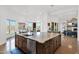 Spacious kitchen island with granite countertop, sink, dishwasher, and cabinets at 8300 E Lone Mountain Rd, Scottsdale, AZ 85266