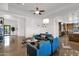 Bright living room featuring modern decor, high ceilings, and view into the open kitchen at 8300 E Lone Mountain Rd, Scottsdale, AZ 85266