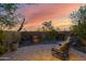 This outdoor patio boasts desert landscaping, a beautiful water feature and comfortable seating for relaxing and entertaining at 8300 E Lone Mountain Rd, Scottsdale, AZ 85266
