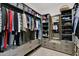 Organized walk-in closet with shelving, drawers, and a full-length mirror at 8300 E Lone Mountain Rd, Scottsdale, AZ 85266