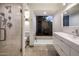 Luxurious bathroom with a walk-in shower, a soaking tub, and contemporary fixtures at 8312 N Golf Dr, Paradise Valley, AZ 85253