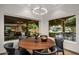 Bright dining area with backyard views, modern lighting, and seating for six at 8312 N Golf Dr, Paradise Valley, AZ 85253