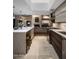 Spacious kitchen with island seating, stainless appliances, and a view into the cozy living room at 8312 N Golf Dr, Paradise Valley, AZ 85253