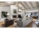 Inviting living room featuring exposed beam ceilings, a fireplace, and comfortable seating at 8312 N Golf Dr, Paradise Valley, AZ 85253