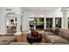 Elegant living room with fireplace, and views of the backyard oasis at 8312 N Golf Dr, Paradise Valley, AZ 85253