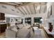 Open living space with a kitchen island and a cozy living room with a fireplace at 8312 N Golf Dr, Paradise Valley, AZ 85253