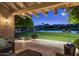 Outdoor patio featuring comfortable seating, a fire pit, and views of the pool and golf course at 8312 N Golf Dr, Paradise Valley, AZ 85253