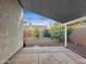 Cozy covered patio looks out to a beautiful desert landscaped backyard and block fence at 8339 W Bluefield Ave, Peoria, AZ 85382