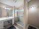 Modern bathroom with walk-in shower, elegant fixtures, and vanity mirror at 8339 W Bluefield Ave, Peoria, AZ 85382