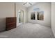 Bright Primary bedroom featuring large window and ensuite bathroom entrance at 8339 W Bluefield Ave, Peoria, AZ 85382
