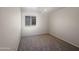 Bright bedroom with neutral walls, ceiling fan, and cozy carpet at 8339 W Bluefield Ave, Peoria, AZ 85382