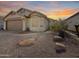 Charming single-story home with desert landscaping and a two-car garage at 8339 W Bluefield Ave, Peoria, AZ 85382