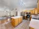 Open-concept kitchen featuring an island, stainless steel appliances, and hardwood floors at 8339 W Bluefield Ave, Peoria, AZ 85382