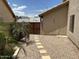 Gravel backyard with decorative fence and gate at 8981 W Tuckey Ln, Glendale, AZ 85305