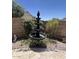 Backyard fountain feature adding a tranquil touch to the outdoor space at 8981 W Tuckey Ln, Glendale, AZ 85305