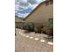 Backyard featuring gravel landscaping, stepping stones, and cacti at 8981 W Tuckey Ln, Glendale, AZ 85305