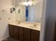 Bathroom vanity with double sinks and mirrors at 8981 W Tuckey Ln, Glendale, AZ 85305