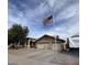 Charming single-story home with a three-car garage and an American flag in a well-maintained community at 8981 W Tuckey Ln, Glendale, AZ 85305