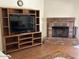 Living room with fireplace and entertainment center at 8981 W Tuckey Ln, Glendale, AZ 85305