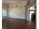 Spacious living room with wood-look tile flooring, and natural light at 8981 W Tuckey Ln, Glendale, AZ 85305