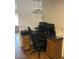 Dedicated home office space with an ergonomic chair and built-in storage, perfect for remote work or study at 8981 W Tuckey Ln, Glendale, AZ 85305