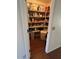 Walk-in pantry with ample shelving, offering substantial storage for food and household essentials at 8981 W Tuckey Ln, Glendale, AZ 85305