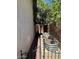 Side yard with gravel, planters, and a tree at 8981 W Tuckey Ln, Glendale, AZ 85305