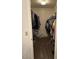 Spacious walk-in closet with plenty of storage on either side at 8981 W Tuckey Ln, Glendale, AZ 85305