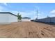 Backyard view of home with large, flat lot ready for landscaping at Xxx S Hunt Hwy, Queen Creek, AZ 85142