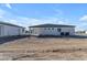 Rear exterior showing spacious lot with detached structure and modern stucco home at Xxx S Hunt Hwy, Queen Creek, AZ 85142