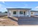Home features a modern covered patio and a spacious backyard at Xxx S Hunt Hwy, Queen Creek, AZ 85142