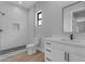 A well-appointed bathroom features white tile, a modern vanity and sleek fixtures at Xxx S Hunt Hwy, Queen Creek, AZ 85142