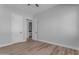 Spacious bedroom with ensuite bathroom and wood-look flooring at Xxx S Hunt Hwy, Queen Creek, AZ 85142