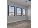 Bright bedroom features modern windows and light wood-look flooring at Xxx S Hunt Hwy, Queen Creek, AZ 85142