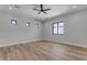 Bright, airy bedroom featuring wood-look floors, modern windows, recessed lighting and a ceiling fan at Xxx S Hunt Hwy, Queen Creek, AZ 85142