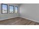 Bright bedroom features modern windows and light wood-look flooring at Xxx S Hunt Hwy, Queen Creek, AZ 85142