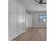 Bright bedroom features wood-look flooring, a ceiling fan, a window and closet doors at Xxx S Hunt Hwy, Queen Creek, AZ 85142