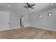 Large bedroom features wood-look floors, a modern ceiling fan, recessed lighting and ample natural light at Xxx S Hunt Hwy, Queen Creek, AZ 85142