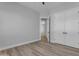 Spacious bedroom with wood-look flooring and ensuite bathroom at Xxx S Hunt Hwy, Queen Creek, AZ 85142