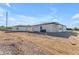 Rear exterior showing spacious lot with detached structure and modern stucco home at Xxx S Hunt Hwy, Queen Creek, AZ 85142