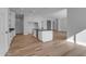 Open kitchen featuring a large island with black countertop and white cabinets at Xxx S Hunt Hwy, Queen Creek, AZ 85142