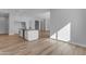 Kitchen island featuring dark countertops, recessed lights, and wood-look floors at Xxx S Hunt Hwy, Queen Creek, AZ 85142