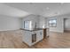 Kitchen island featuring dark countertops, recessed lights, and wood-look floors at Xxx S Hunt Hwy, Queen Creek, AZ 85142