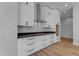 Kitchen with white cabinetry, stainless steel hood, and dark stone countertops at Xxx S Hunt Hwy, Queen Creek, AZ 85142