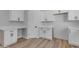 Kitchen boasts white cabinets, wood-look flooring and adjacent countertop space at Xxx S Hunt Hwy, Queen Creek, AZ 85142