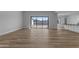 Open-concept living room featuring wood-look floors, mountain views, and ample natural light at Xxx S Hunt Hwy, Queen Creek, AZ 85142