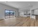 Open-concept space features wood-look floors, stunning mountain views, recessed lighting, and modern finishes at Xxx S Hunt Hwy, Queen Creek, AZ 85142