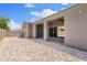 An extended covered patio offers relaxing outdoor living space with a paved backyard at 10134 E Talon Ave, Mesa, AZ 85212
